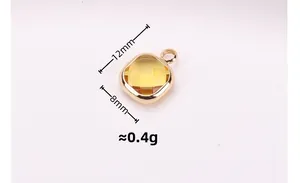 Macro detail of a 12x8mm faceted yellow crystal pendant with gold-plated bezel setting