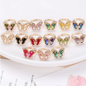 Detailed collection of crystal butterfly rings with 18K gold adjustable open bands