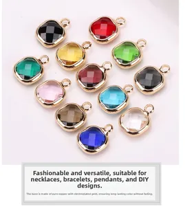 Detailed macro view of 12 colors of square faceted crystal charms with gold-plated copper bases