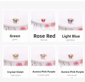Detail showing crystal butterfly rings in green, rose red, blue, and violet shades