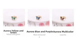 Detailed macro view of three butterfly rings with aurora yellow, blue, and colorful crystals