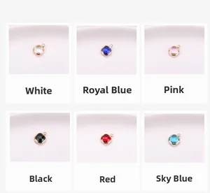 Detail view of square glass crystal pendants with gold-plated copper edges in six colors