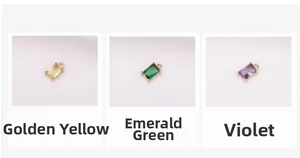 Three rectangular faceted crystal charms in gold, peacock green, and violet colors