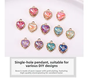 Close-up of 12 colors of heart crystal charms with gold copper lace settings for DIY jewelry