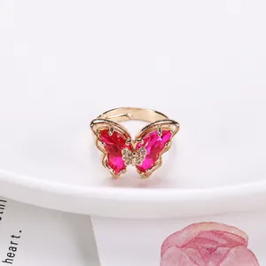 18K gold butterfly open ring with pink crystals, dimensions 22mm by 31mm and 3.6g weight