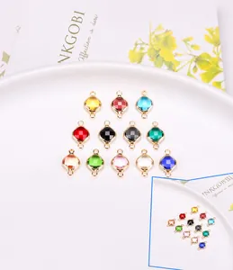 Macro shot of colorful square crystal pendants with gold bezel connectors for jewelry making