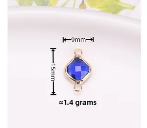 Macro detail of a 9x15mm blue square crystal connector with gold plated trim for DIY jewelry