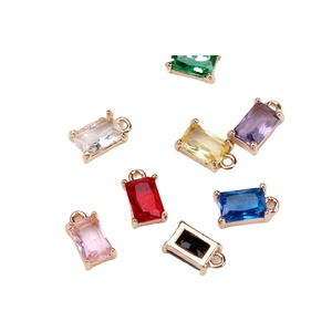 Set of eight colorful emerald-cut crystal pendants with gold-plated brass four-prong settings