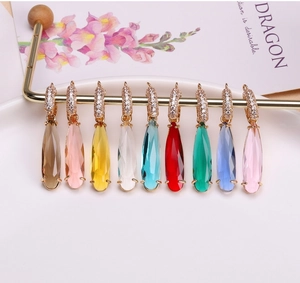 Detail of nine faceted water drop crystal pendants with gold plated diamond-set ear hooks