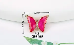 Detail view of 14K gold filled butterfly pendant with rose crystals and 22mm x 16mm size