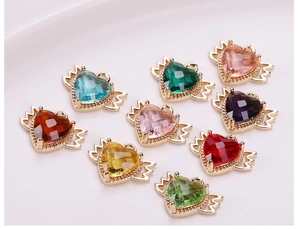 Detailed collection of gold plated heart wing pendants with colorful faceted crystals