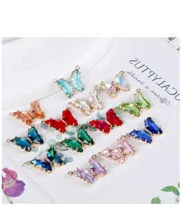 Macro view of 14K gold filled butterfly pendants with multi-colored crystals for DIY jewelry