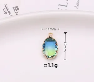 Detail view of oval gradient tourmaline pendant with gold claw setting measuring 11x19mm