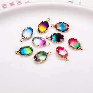 Detail of oval gradient crystal pendants with gold-plated copper claw settings in a set