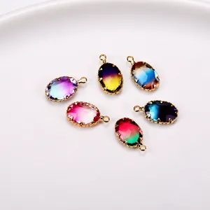 Detailed view of oval gradient crystal pendants with faceted glass and gold metal claws