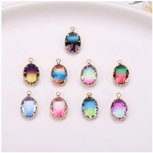 Macro view of nine gradient crystal oval pendants with gold claw settings for DIY jewelry
