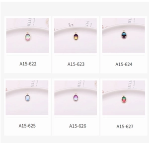 Detailed grid of oval tourmaline crystal pendants in vibrant gradient colors and gold claw settings
