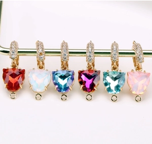 Macro shot of colorful leopard heart charms with gold plating and zircon inlay