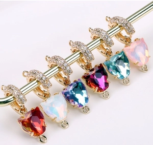 Macro view of multi-colored heart gemstone pendants for DIY jewelry making and craft projects