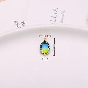 Oval gradient blue-green tourmaline crystal pendant in gold claw setting 11x19mm