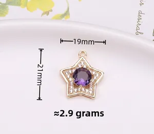 Macro shot of 19x21mm star pendant featuring purple cubic zirconia and gold plating