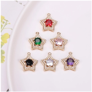 Detailed view of six colorful star-shaped gold-plated pendants with cubic zirconia inlay
