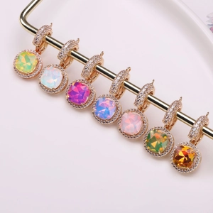 Set of seven square copper pendants with colorful crystals and sparkling zircons