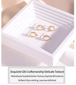 Macro detail of 14K gold plated crystal earrings with 925 silver pins for DIY jewelry