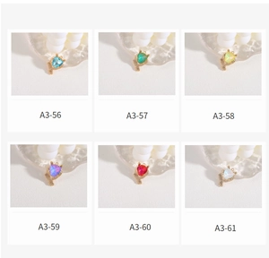 Detailed view of colorful triangular cheetah pendants in six vibrant stone colors