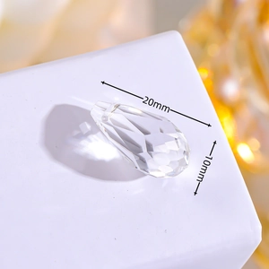 Macro view of 20x10mm teardrop crystal glass pendant with faceted surface for jewelry