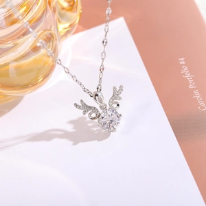 Detailed view of silver deer antler necklace with a sparkling round zircon stone