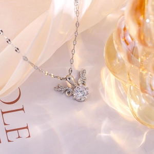 Elegant deer antler necklace with round moissanite pendant on white silk background