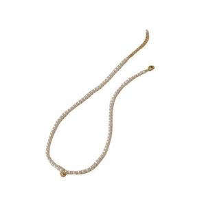 French retro pearl necklace with a central gold bead and adjustable lobster clasp