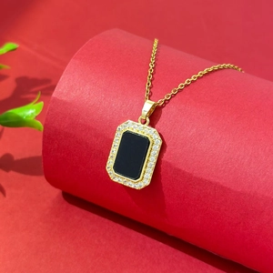 Elegant gold titanium steel necklace featuring a black onyx pendant with zircon halo