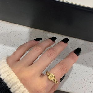 Vintage Queen Elizabeth coin ring in gold finish featuring relief portrait and textured band
