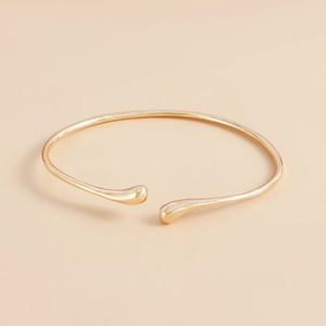 Polished gold minimalist open collar necklace with elegant teardrop ends and glossy finish
