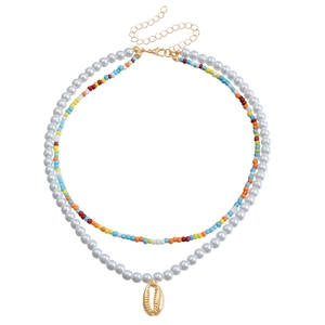 Double-layer necklace with white pearls, a gold shell pendant, and colorful seed beads