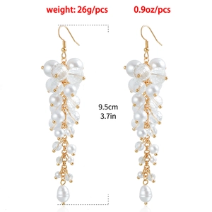 Detailed view of pearl tassel earrings with dimensions showing 9.5cm length and 26g weight