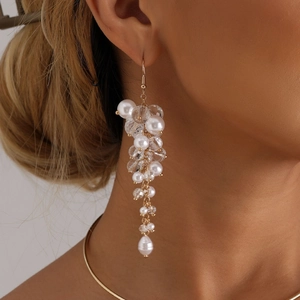 Elegant Baroque style long fringe earrings with pearls and crystals on female model