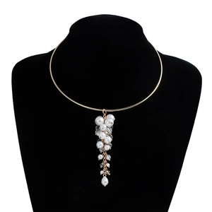 Detail showing vintage baroque pearl cluster pendant and golden choker on black stand