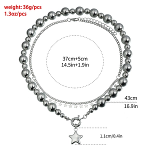 Detail showing double-layer silver star necklace with weight and size specifications