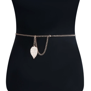 Detail of gold leaf pendant and delicate double-layered metal chain on the waist belt