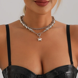 Double-layered silver star necklace featuring metallic bead chain and star pendants