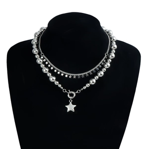 Three-layer silver star pendant necklace with polished bead chains on a black bust