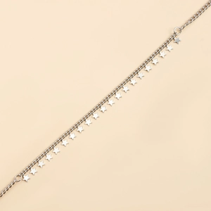 Macro detail of silver star charms on a delicate metal chain with a polished finish
