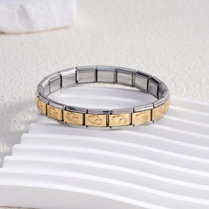 Italian charm bracelet with modular stainless steel links featuring gold double heart relief