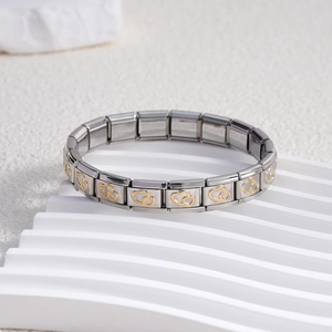 Italian modular stainless steel bracelet with gold double heart patterns at a 45-degree angle