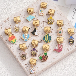 Italian charm bracelet links in gold stainless steel with ocean themed enamel pendants