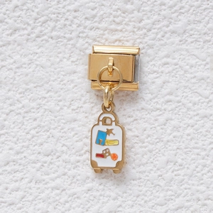 Italian charm bracelet link in gold tone with a colorful enamel suitcase pendant