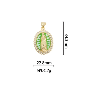 Macro detail of Guadalupe oval pendant with green enamel and 18k gold plating